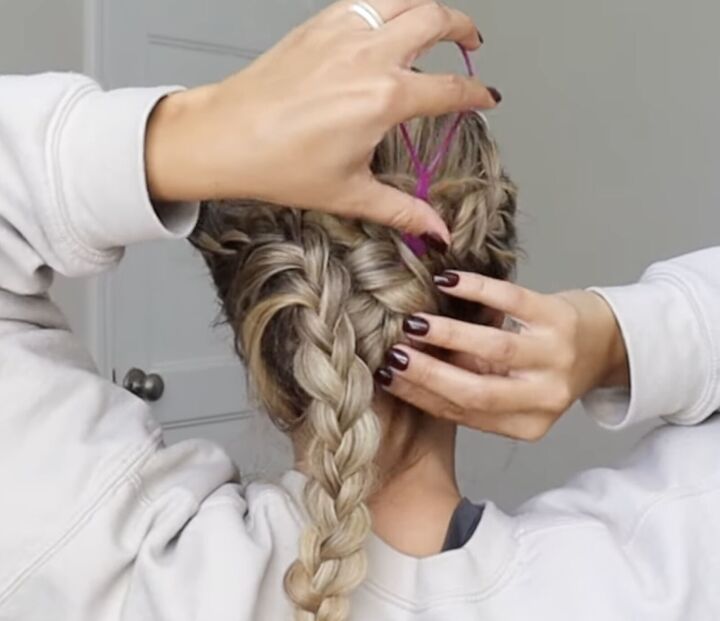 how to do a gorgeous lace french braid updo for a special occasion, Using a topsy tail tool to wrap the braid