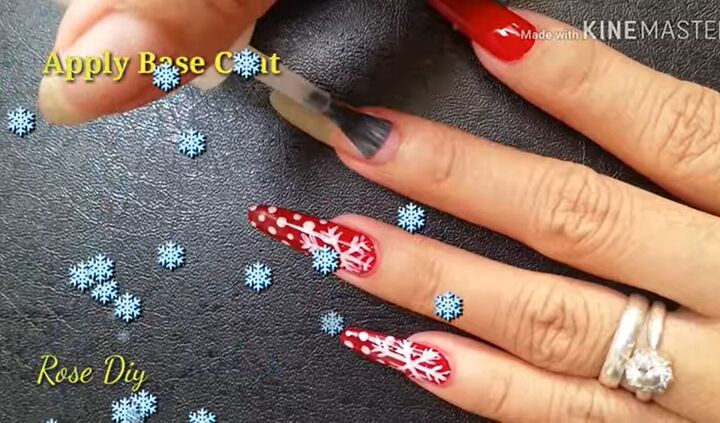 ready for christmas here s how to do cute red nails with snowflakes, Applying a clear base coat to the nail