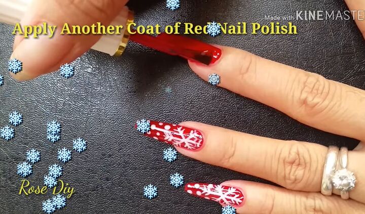 ready for christmas here s how to do cute red nails with snowflakes, Applying a second coat of red polish