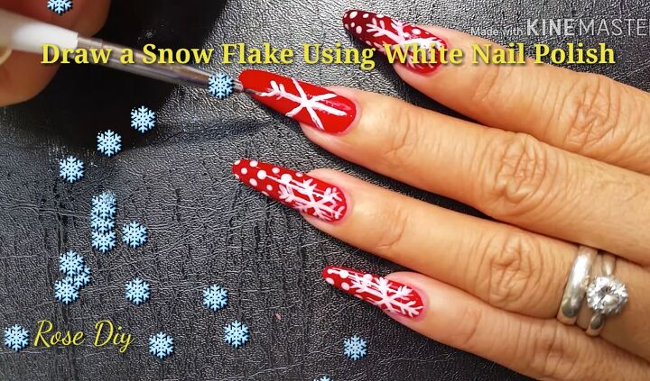 ready for christmas here s how to do cute red nails with snowflakes, Drawing a snowflake on nails