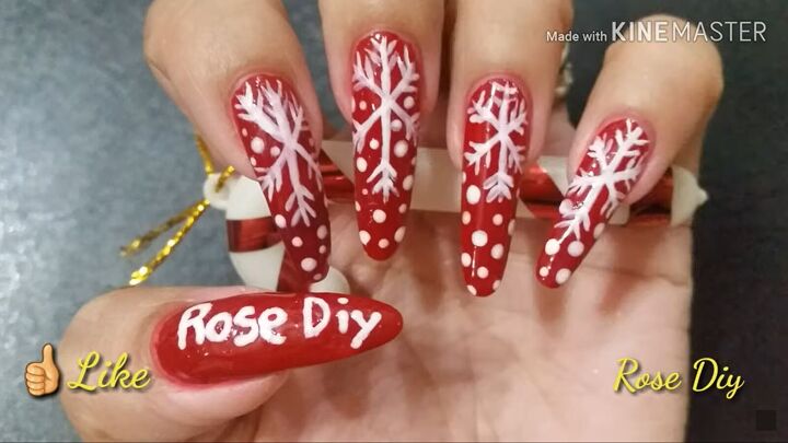 ready for christmas here s how to do cute red nails with snowflakes, Red nails with snowflakes