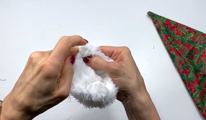 how to make a santa hat with faux fur trim in 7 quick easy steps, Making a pompom for the DIY Santa hat