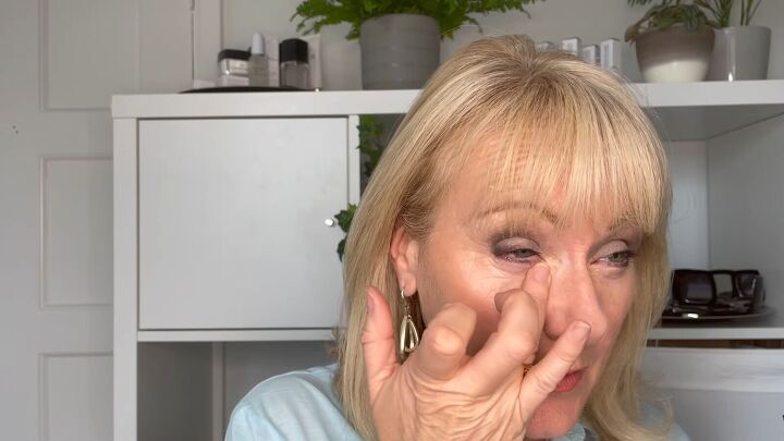 how to cover dark circles under eyes on mature skin step by step, Blending the concealer with fingers