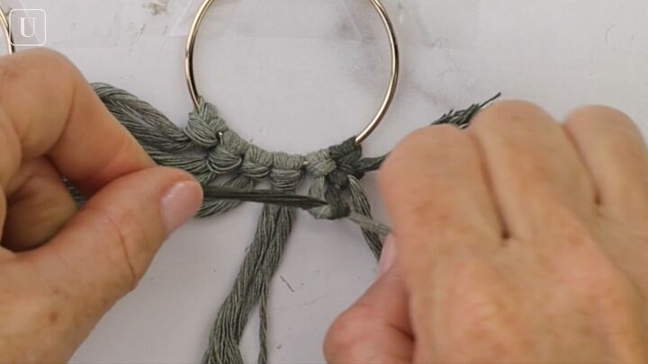 these cute diy macrame hoop earrings are super easy to make, Knotting each piece of yarn twice