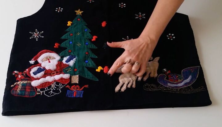 this diy ugly christmas sweater dress is the perfect amount of tacky, Sewing the Christmas best to the skirt