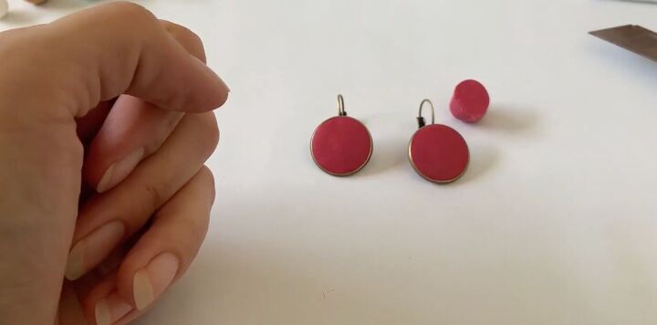 these intricate diy poinsettia earrings are made from polymer clay, Flattening the polymer clay earring base