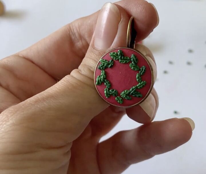 these intricate diy poinsettia earrings are made from polymer clay, Forming a Christmas wreath on the earrings