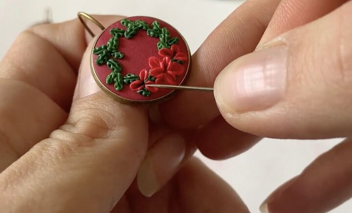 these intricate diy poinsettia earrings are made from polymer clay, Polymer clay Christmas earring ideas