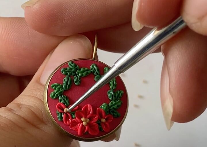 these intricate diy poinsettia earrings are made from polymer clay, Adding gold clay to the center of the flowers