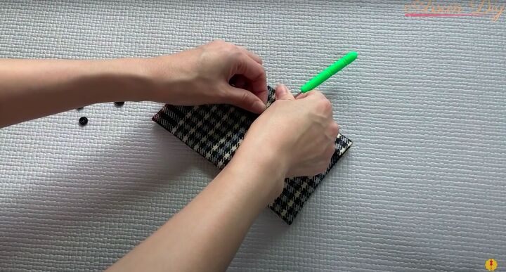 how to make a simple diy envelope purse great gift idea, Creating a hole for the plastic snap