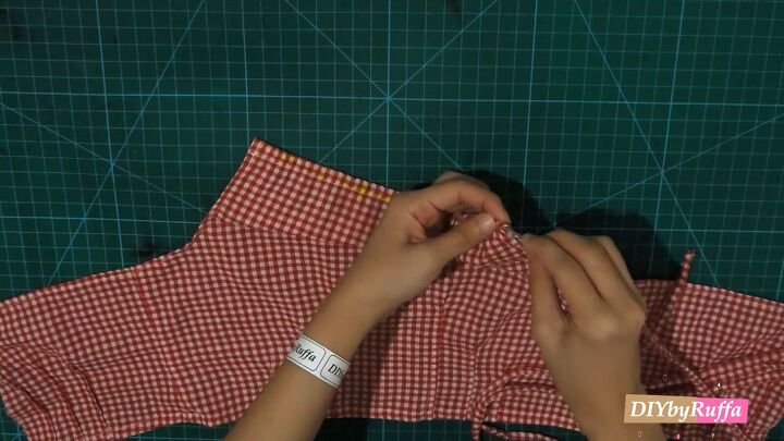 how to repurpose a button down shirt to make a diy tie back crop top, Inserting the tie into the casing