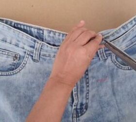 how to downsize jeans with without sewing 6 different ways, Snipping the inner layer with scissors