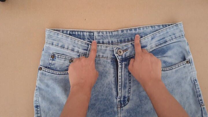 how to downsize jeans with without sewing 6 different ways, Marking the inside jean waistband with pencil