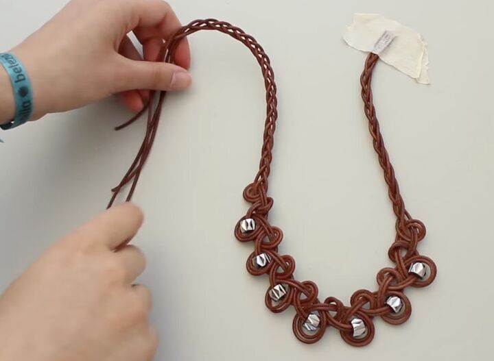 how to make a leather necklace with knots braids silver beads, Braiding the opposite end of the necklace