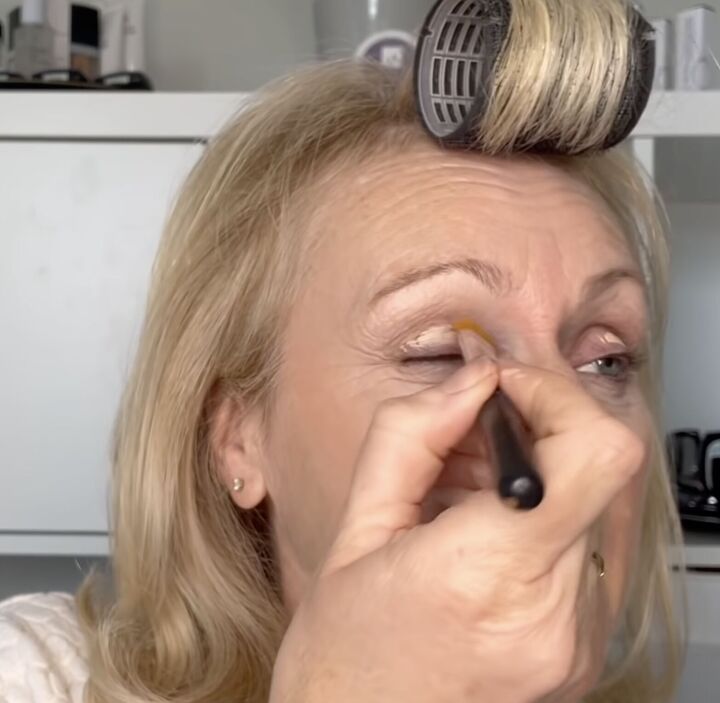 how to rock a smokey eye as an older woman mature makeup tutorial, Spreading the primer with a brush