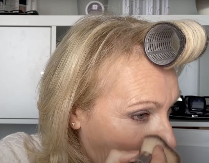 how to rock a smokey eye as an older woman mature makeup tutorial, Brushing away eyeshadow debris