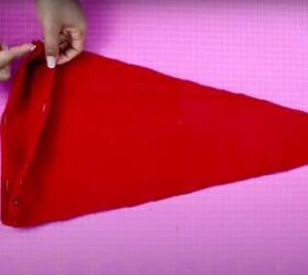 how to make a santa hat fun festive activity to do with family, Hemming the bottom of the DIY Santa hat