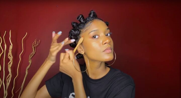 how to do a perfect hollywood style bantu knot out on blow dried hair, Laying edges with gel and a brush