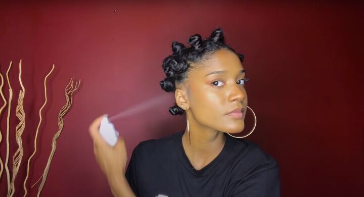 how to do a perfect hollywood style bantu knot out on blow dried hair, Spraying Bantu knots with hair spray