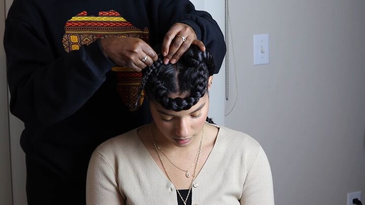 how to create a striking protective braided updo step by step, Pinning the braid in place with bobby pins