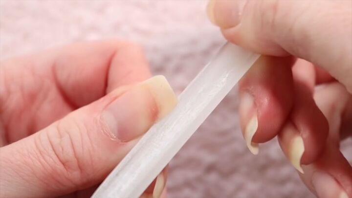 how to take care of nails in winter nail care tips fun blue polish, Filing nails with a crystal nail file