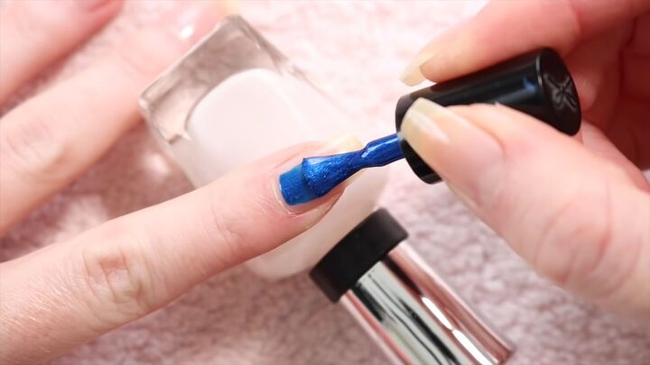 how to take care of nails in winter nail care tips fun blue polish, Applying blue nail polish to nails