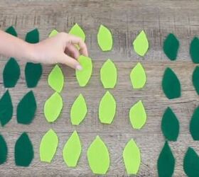 6 amazing diy ugly christmas sweater ideas including 1 for hanukkah, Cutting out leaf shapes in green felt