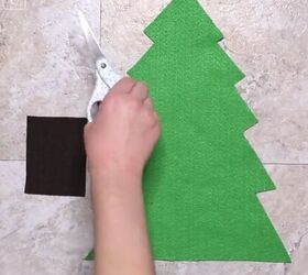 6 amazing diy ugly christmas sweater ideas including 1 for hanukkah, Cutting out a green Christmas tree shape in felt