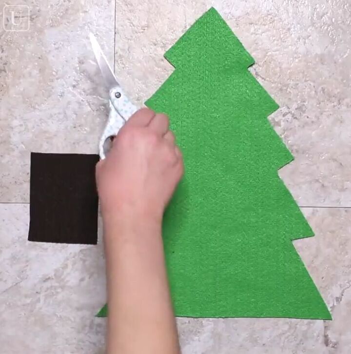6 amazing diy ugly christmas sweater ideas including 1 for hanukkah, Cutting out a green Christmas tree shape in felt