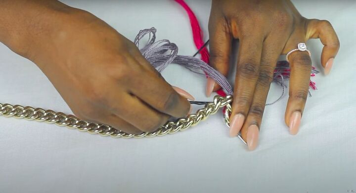 how to make a statement chain necklace out of an old purse strap, Knotting the threading through the chain