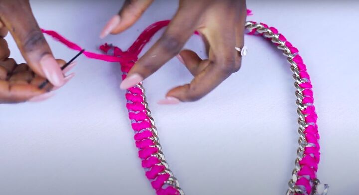 how to make a statement chain necklace out of an old purse strap, Making a clasp using the embroidery thread