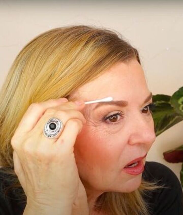 eyebrows over 50 how to shape eyebrows for older ladies, Cleaning up brows with a Q Tip