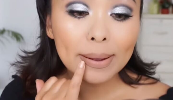 makeup hack how to put on nude lipstick without looking washed out, Softening the line with a finger