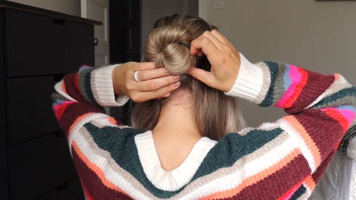 5 easy holiday hairstyles ponytails braided updos chignons more, Securing the twisted bun with a bobby pin