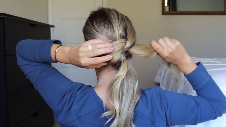 try this easy updo hair hack for a sophisticated elegant hairstyle, Pulling hair through the hole