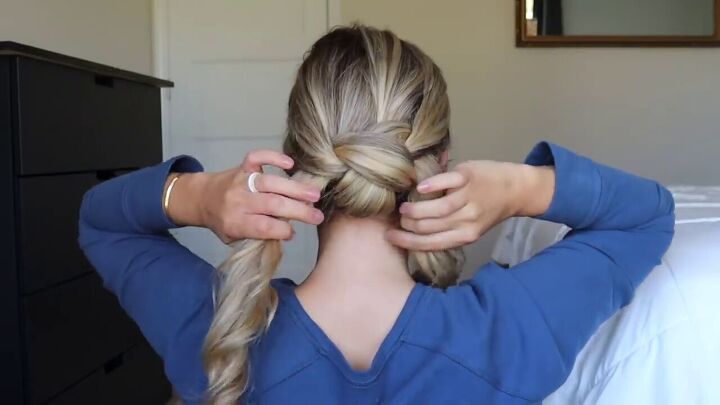 try this easy updo hair hack for a sophisticated elegant hairstyle, Pulling the other side through the hole