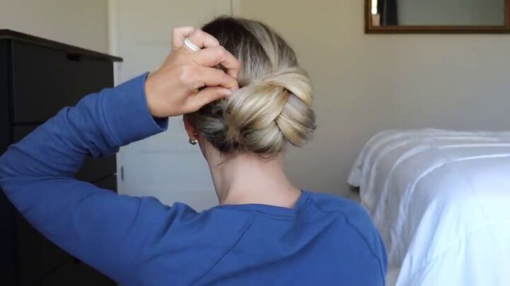 try this easy updo hair hack for a sophisticated elegant hairstyle, Adding bobby pins to secure the updo