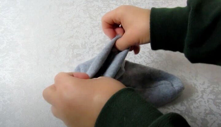 how to make fleece slipper socks to keep your toes cozy this winter, Hemming the fleece socks
