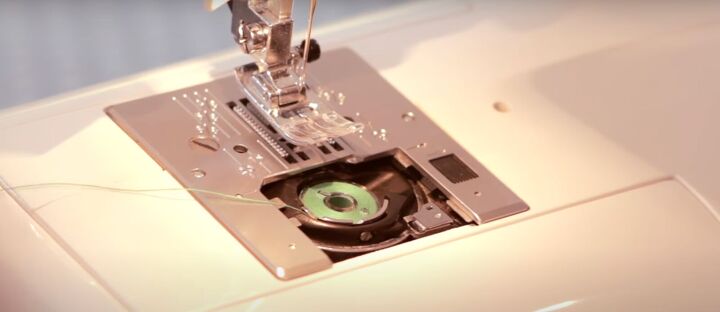 basic sewing skills how to thread a sewing machine step by step, Dropping the bobbin in the bobbin case
