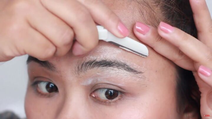 looking for painless brow grooming here s how to shave your eyebrows, Shaving eyebrows with an eyebrow shaver