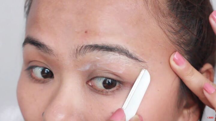 looking for painless brow grooming here s how to shave your eyebrows, Shaving in the opposite direction from growth