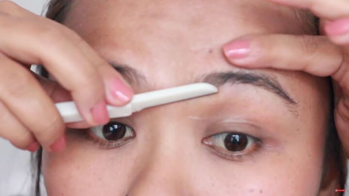 looking for painless brow grooming here s how to shave your eyebrows, Carefully using an eyebrow shaver