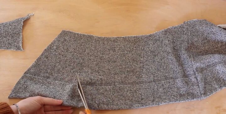 how to make a diy cropped sweater fix an unflattering fit, Cutting open the loop at the seam