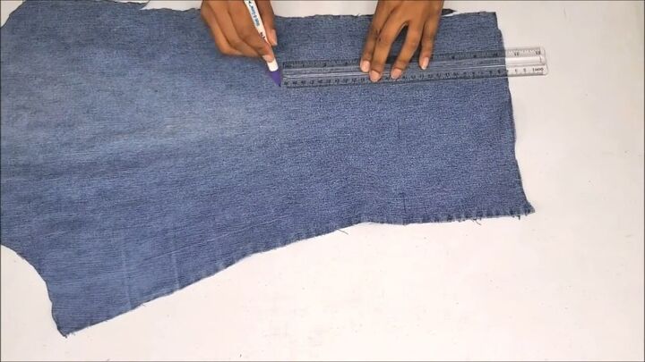 how to make a cute boho style diy fringe purse out of old jeans, Measuring and marking the denim fringe
