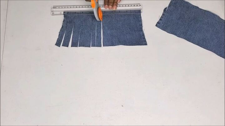 how to make a cute boho style diy fringe purse out of old jeans, How to make a fringe jean purse