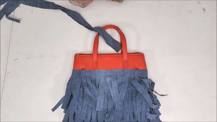 how to make a cute boho style diy fringe purse out of old jeans, Making a DIY denim fringe purse