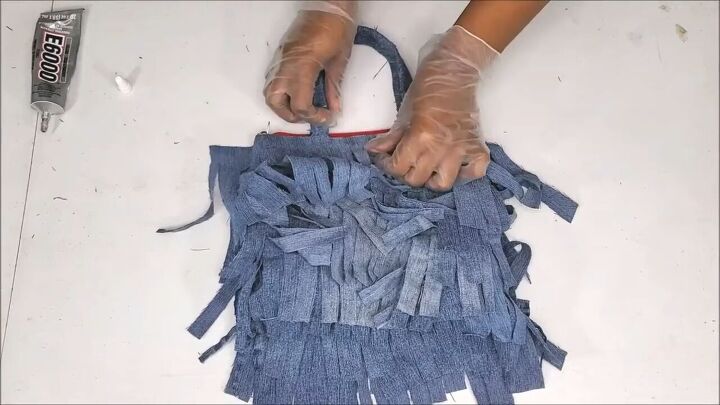 how to make a cute boho style diy fringe purse out of old jeans, Making a cute DIY fringe purse