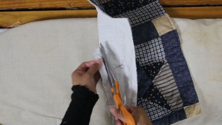 how to make a cozy reversible quilted jacket out of old blankets, Cutting the bulk between the layers