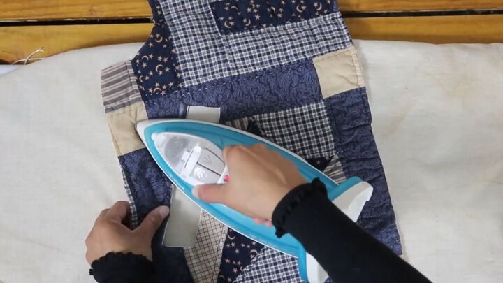 how to make a cozy reversible quilted jacket out of old blankets, Pressing the linen piece to the inside