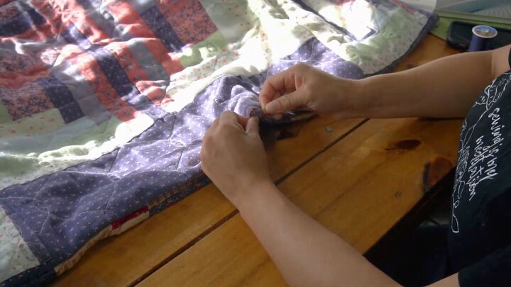 how to make a cozy reversible quilted jacket out of old blankets, Hand sewing the opening closed